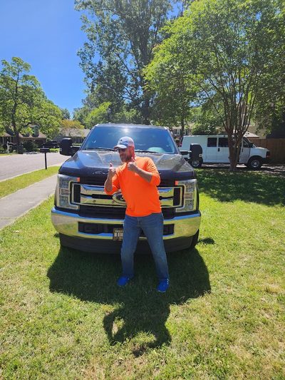Satisfied customer with completed windshield replacement on Ford F-250 in Berkeley County