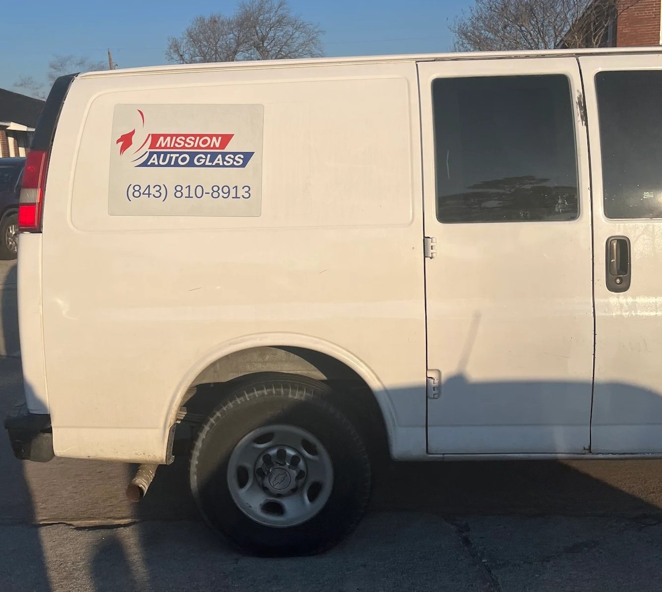 Mission Auto Glass branded service van with phone number (843) 810-8913 — mobile auto glass service Charleston SC